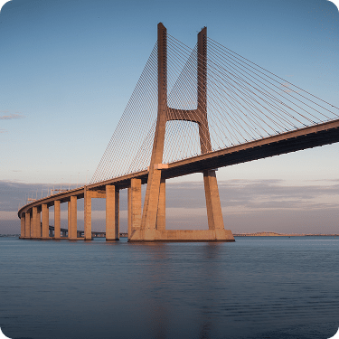 Imposing view of the Vasco da Gama Bridge over the Tagus River in Lisbon, Europe's longest bridge, showcasing Portugal's modernity and excellent infrastructure.