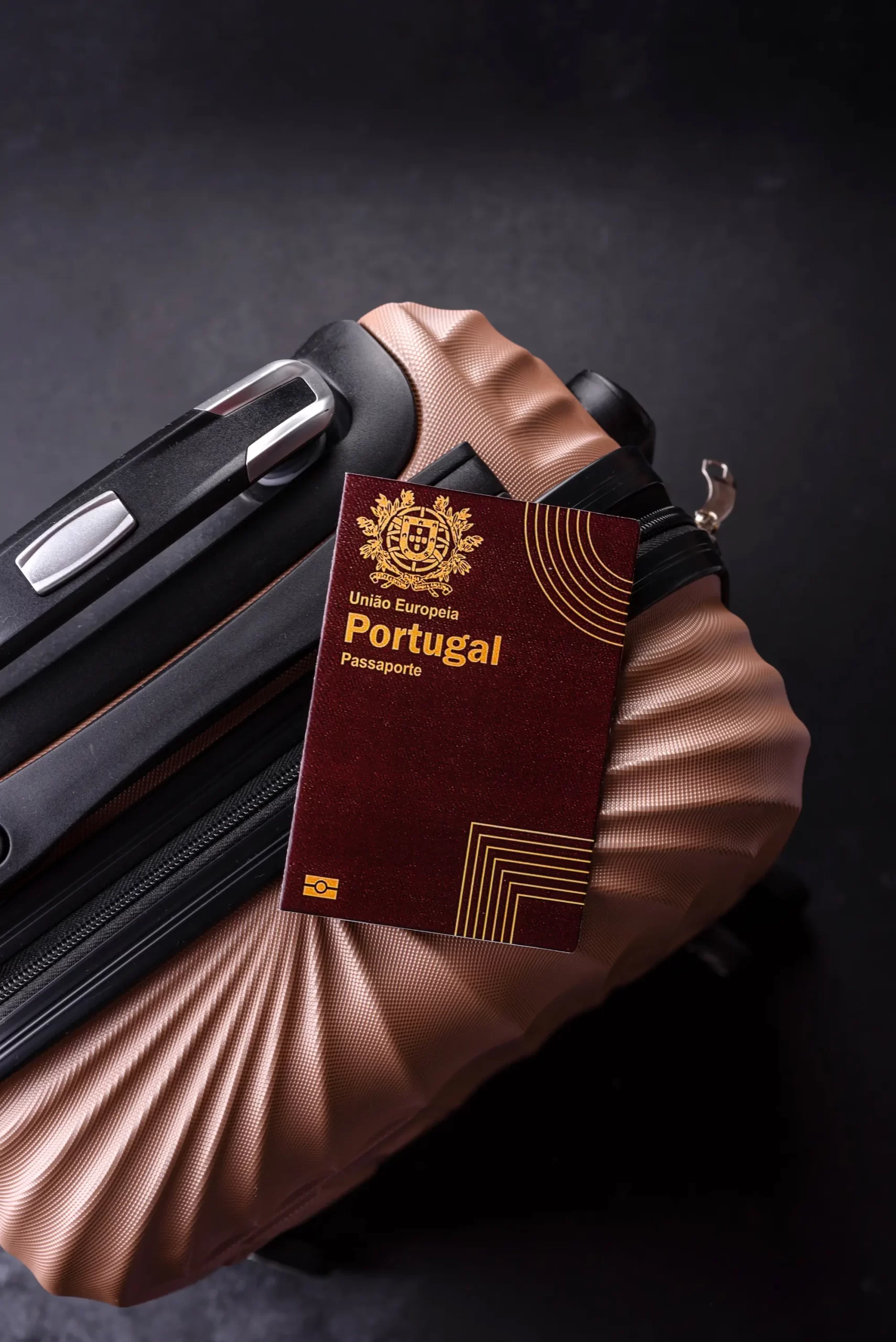 Portuguese European Union passport resting on a suitcase, symbolizing travel freedom and EU citizenship obtained through the Golden Visa program.